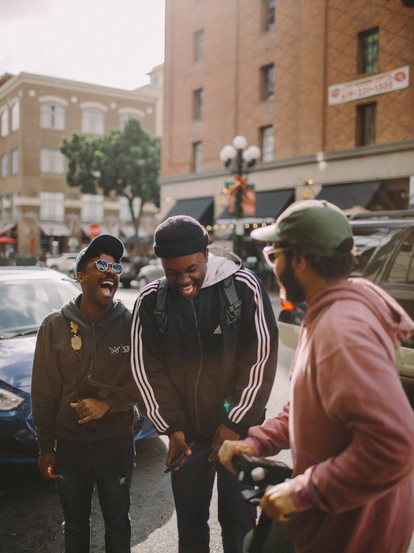 Three friends laughing together